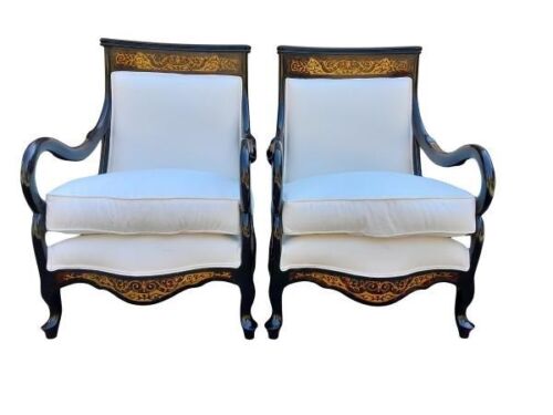A 20th Century Pair Of French Style Armchairs With Brass Inlay In An Ebonised Finish And Upholstered In A White Cotton