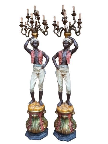 A 20TH Century Large And Highly Decorative Pair Of Venetian Style Blackamoors With Giltwood Electrified Chandeliers