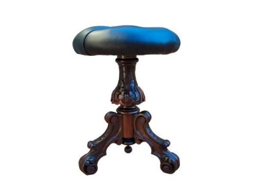 An Antique Victorian Carved Rosewood Piano Stool Upholstered In Leather