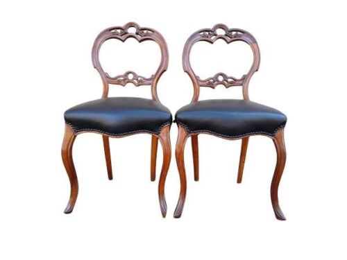 An Antique Pair Of Victorian Walnut Balloon Back Chairs