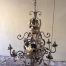 A Round base Wrought Iron Hand Painted Chandelier with crown detail 