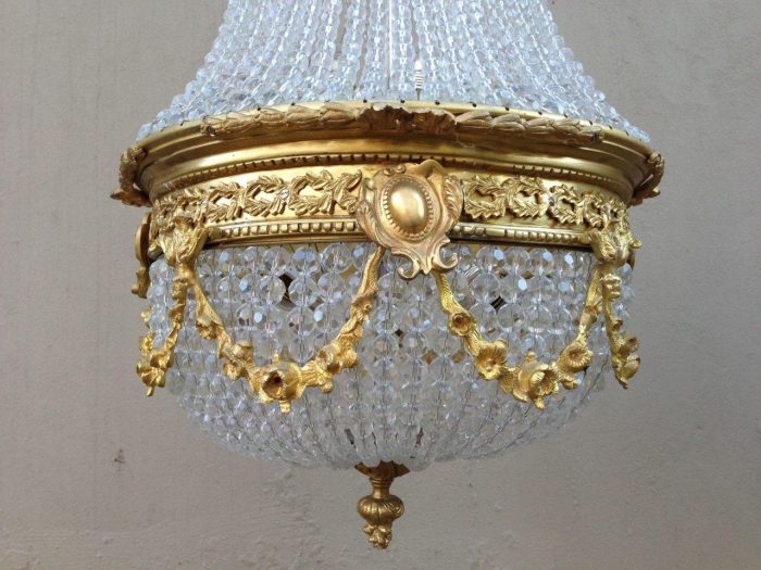 A 20th Century Empire Style Brass and Crystal Chandelier - Image 2