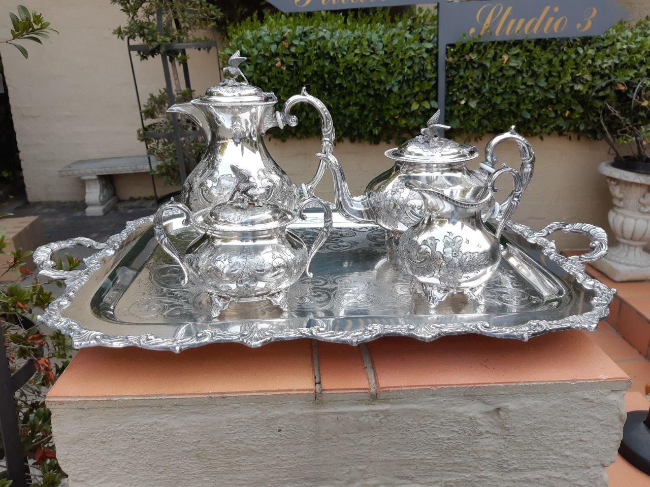A Victorian silver plate John Turnton four 4 piece tea set on a Marlborough Old Sheffield two handled silver plate tray The Crown Collection