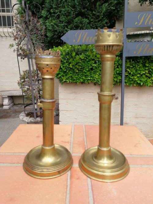 A Set Of Two Ecclesiastical Brass Candlesticks