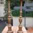 A pair of gilt-painted candle sticks on paw feet