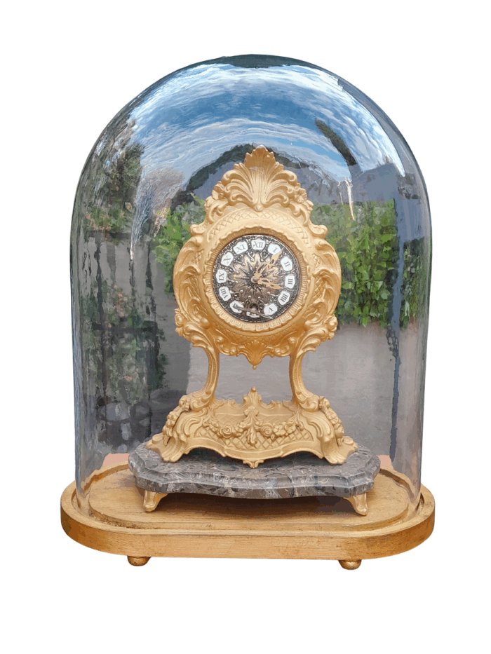 A 19th Century French Gilt Metal Clock in Glass Cloche with Hand Gilded Wooden Base