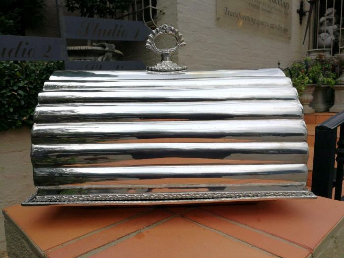 A Silver-Plated Barrel Cloche With Platter