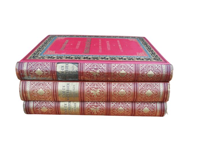 A Set Of Late 19th Century Circa 1885/1890 Extra-Large Size Decorative Books Entitled Stam En Wapenboek Van Aanzienlijke Nederlandsche Familien In Red Hardcovers With Gilt-Lettering And Tooling