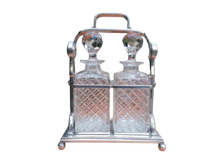 A Silver- Plate Tantalus With Two Cut-Glass Decanters