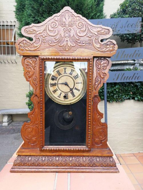 An Early 20th Century  Ornate Carved Oak Mantel Clock