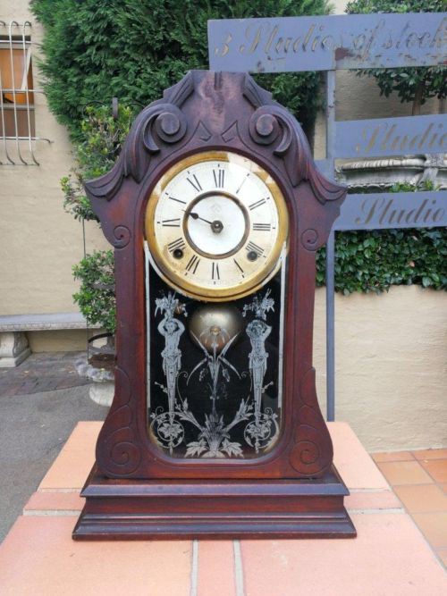 An Early 20th Century American Carved Oak Mantel Clock