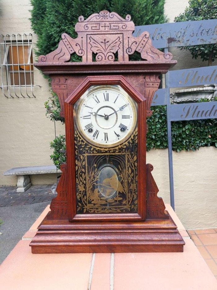 An Early 20th Century English Carved Walnut Mantel Clock