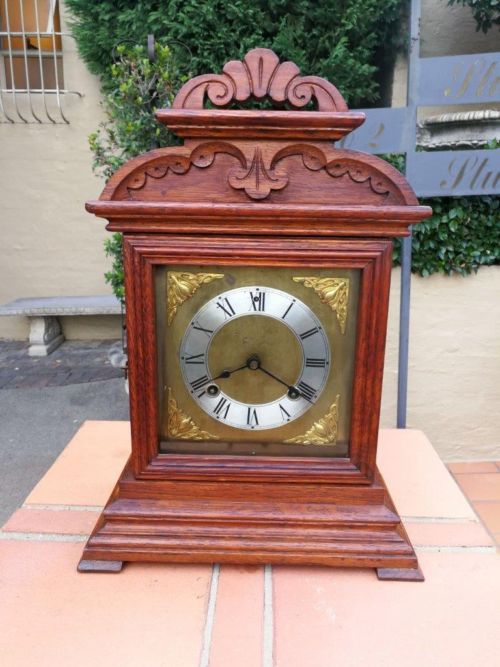 An Antique Oak French Mantel Clock