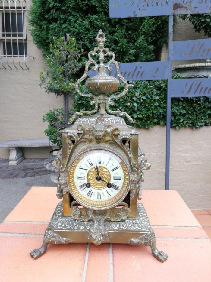 A late 19th/Early 20th Century French brass clock With Pendulum and Key