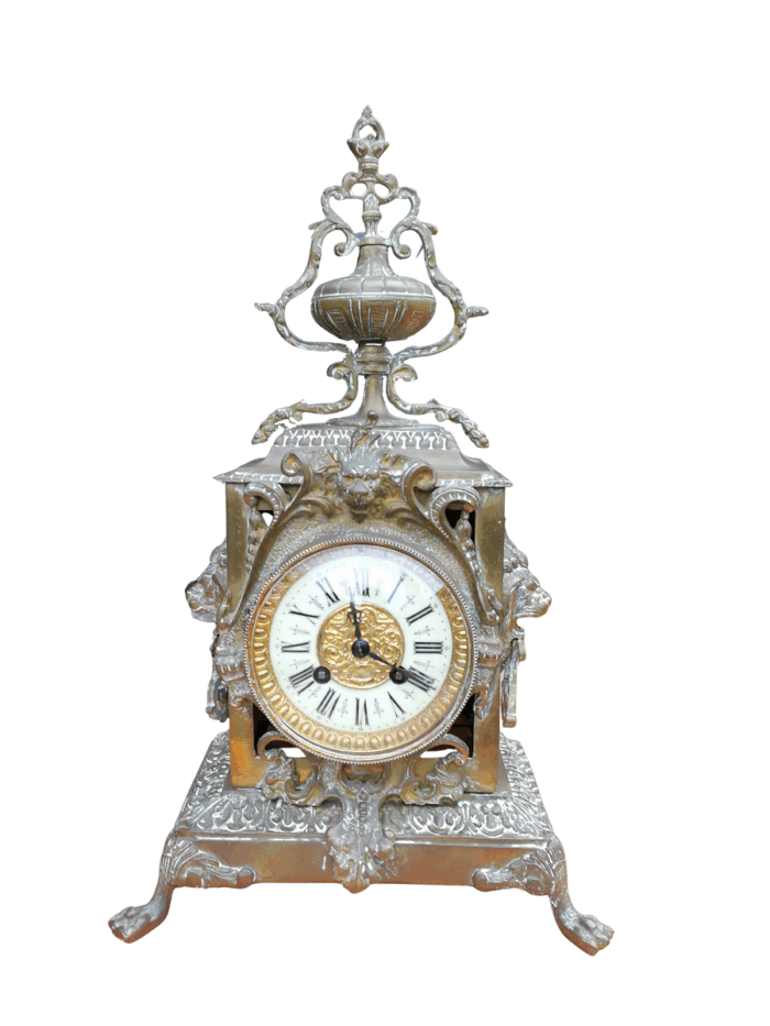 A late 19th / Early 20th Century French brass clock With Pendulum and Key