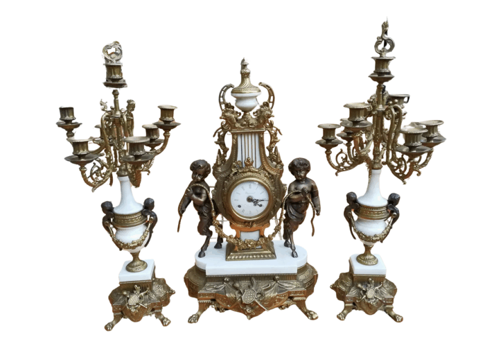 An Antique Circa Early 1900 Brass Garniture Clock Set with Key. Comprising a Clock and Pair of Candelabras
