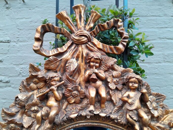A 20th Century Baroque Style Heavily Carved And Ornate Gilt-Framed Bevelled Glass Mirror - Image 4