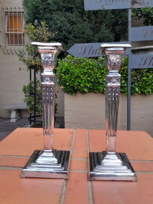 A Pair Of Electroplate Candlesticks