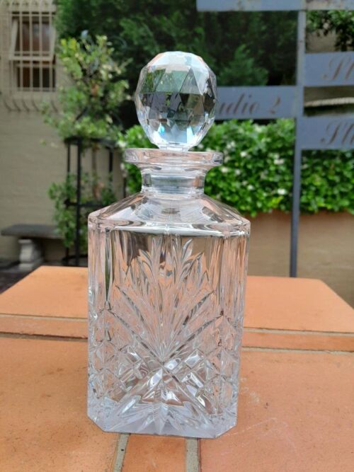 A Hand Blown Crystal Decanter With Stopper