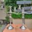A 20TH Century Pair of Silver Plated Embossed Candelabra