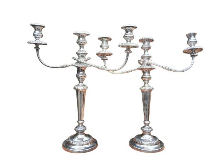 A 20TH Century Pair of Silver Plated Embossed Candelabra