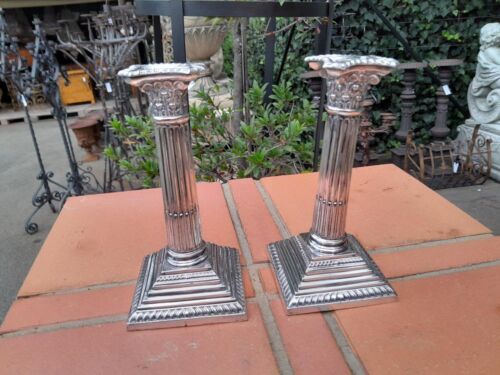 A 20TH Century Pair of Sheffield Plate Corinthian Pillar Candle Holders