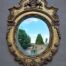 A 20th Century Carved and Gilded Bevelled Oval Mirror