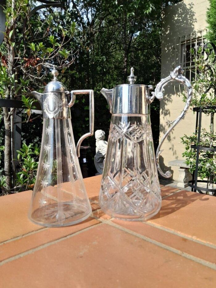 A 20th Century Set of Two Claret Jugs with EPNS Handles and Lids