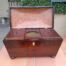 An antique 19th Century Mahogany Tea Caddy with Brass Lions Head Handles