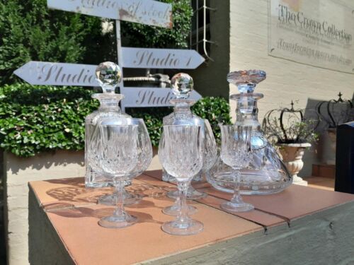 A Crystal and Glass Collection of Decanters with Silver Hallmarked Labels Whiskey