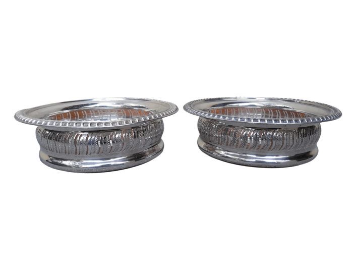 A 20th Century Pair Of Mappin & Webb Silver Plated Wine Coasters