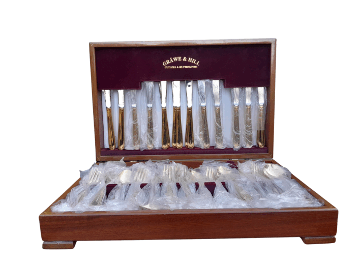 A Grawe And Hill Gold-Plated Cutlery Set With Maroon Lining In A Canteen