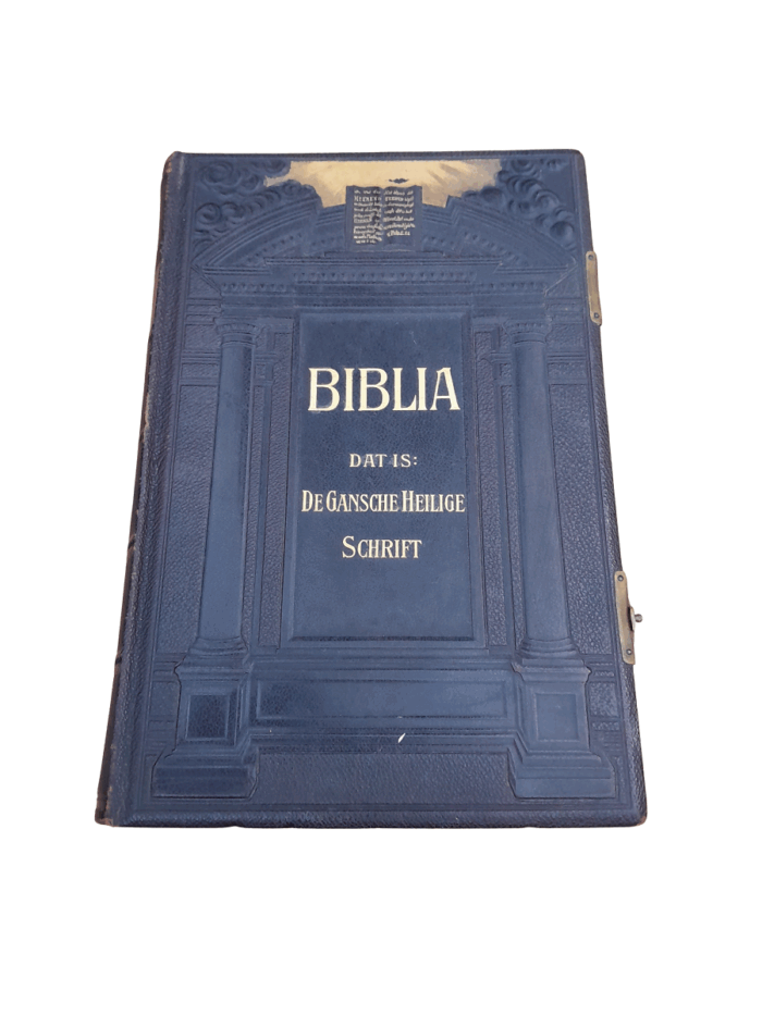 A Leather Bound Bible With Brass Clasps And Mounts