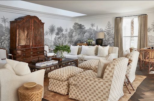 An antique armoire makes for a great statement piece in the lounge