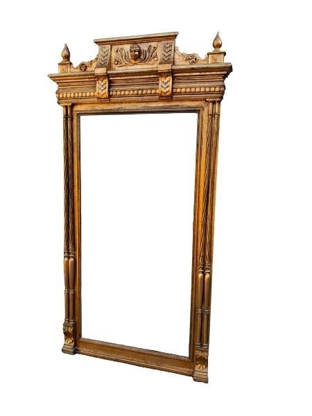 An Antique French  Giltwood And Bevelled Pier Mirror With Ornate Carving